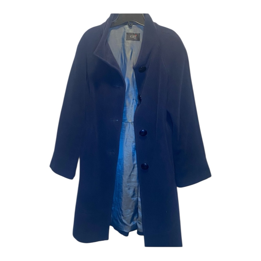 Wool and mohair blend coat with structured vintage tailoring.